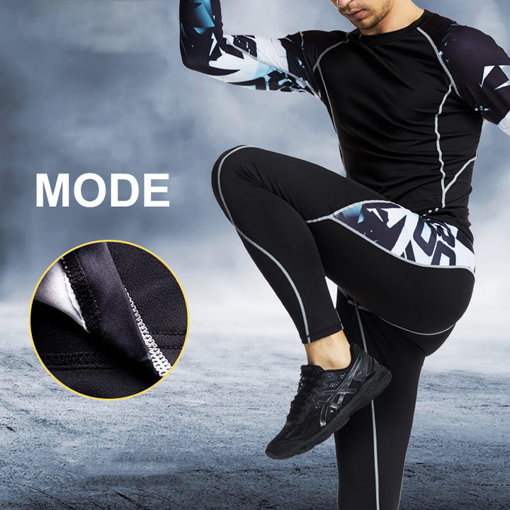 "Herr sportkläder tights och långärmad tröja i grått, stretchigt tyg, designad för träning och rörelsefrihet."