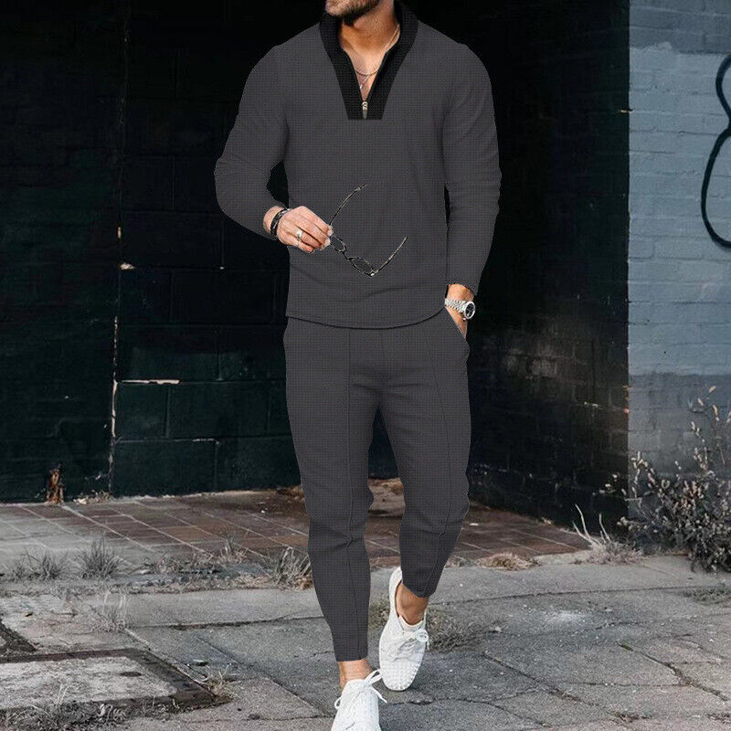 Elegant tvådelad herr fritidsoutfit med dragkedja, enkel och modern för en avslappnad look.