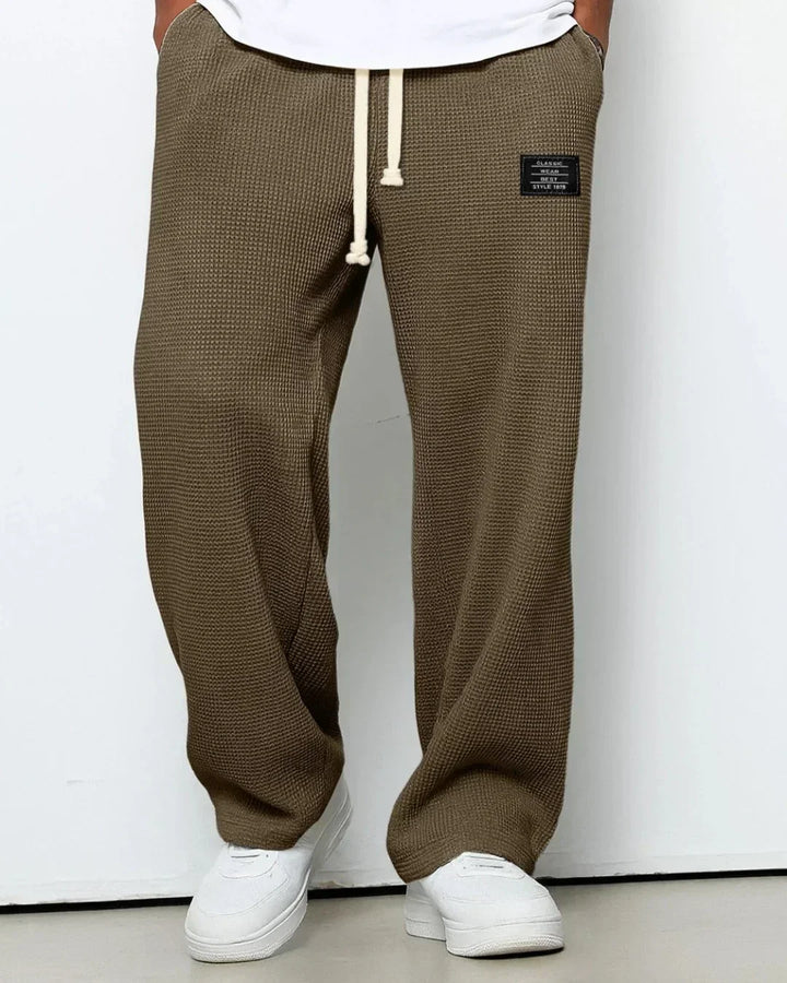 Herrars bekväma dragsko byxor för fritid, med mjuk komfort och casual stil. Enkel att bära.