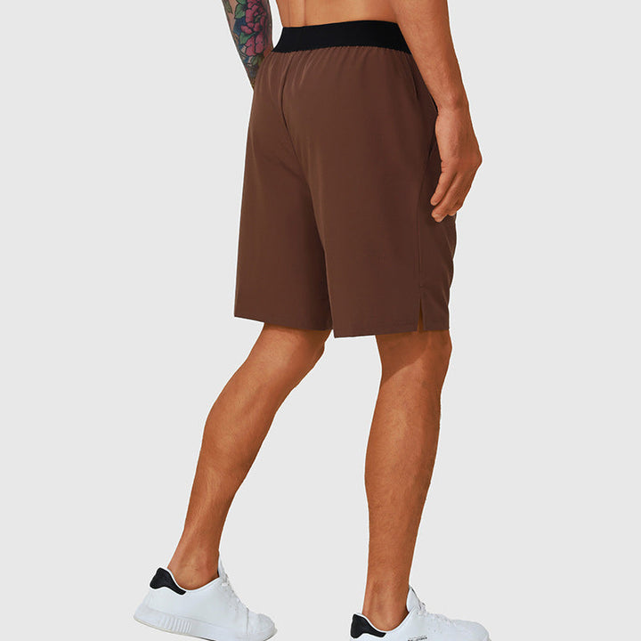 Detaljbild av sidofickor på herrars snabbtorkande fritidsshorts, praktiska för förvaring.