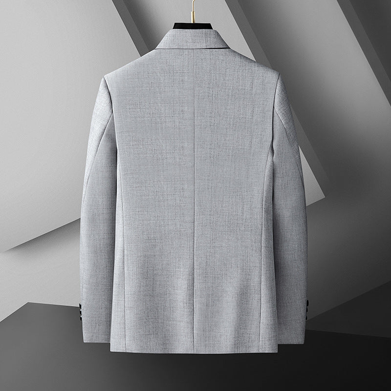 Mörkgrå herrblazer, modern passform, elegant krage, mångsidig för både business och fritid.