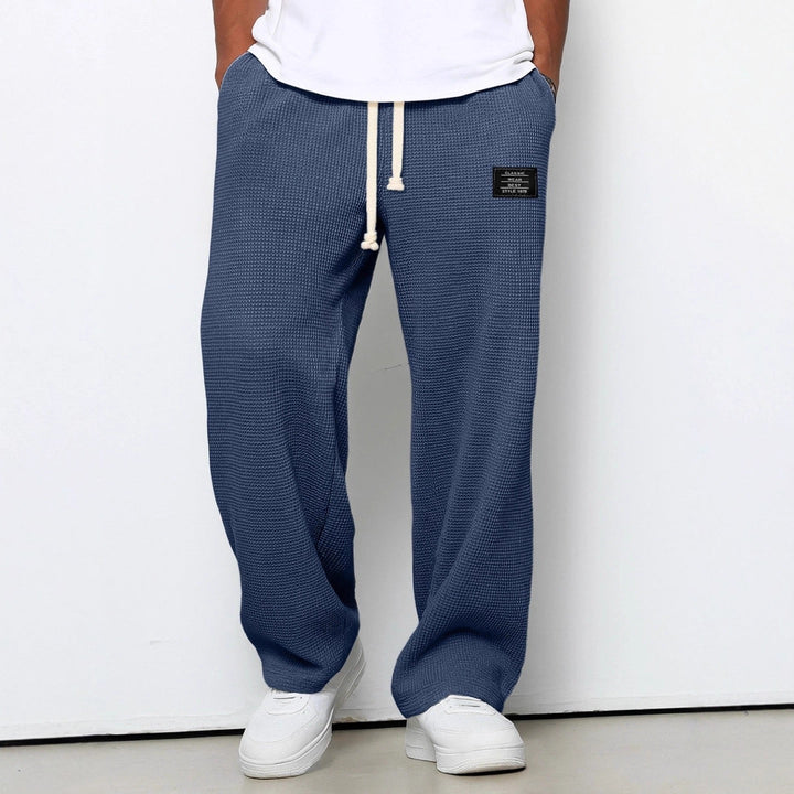 Detaljbild av tyget på Herrbyxor Relaxed Fit, mjukt och slitstarkt för resor och fritid.