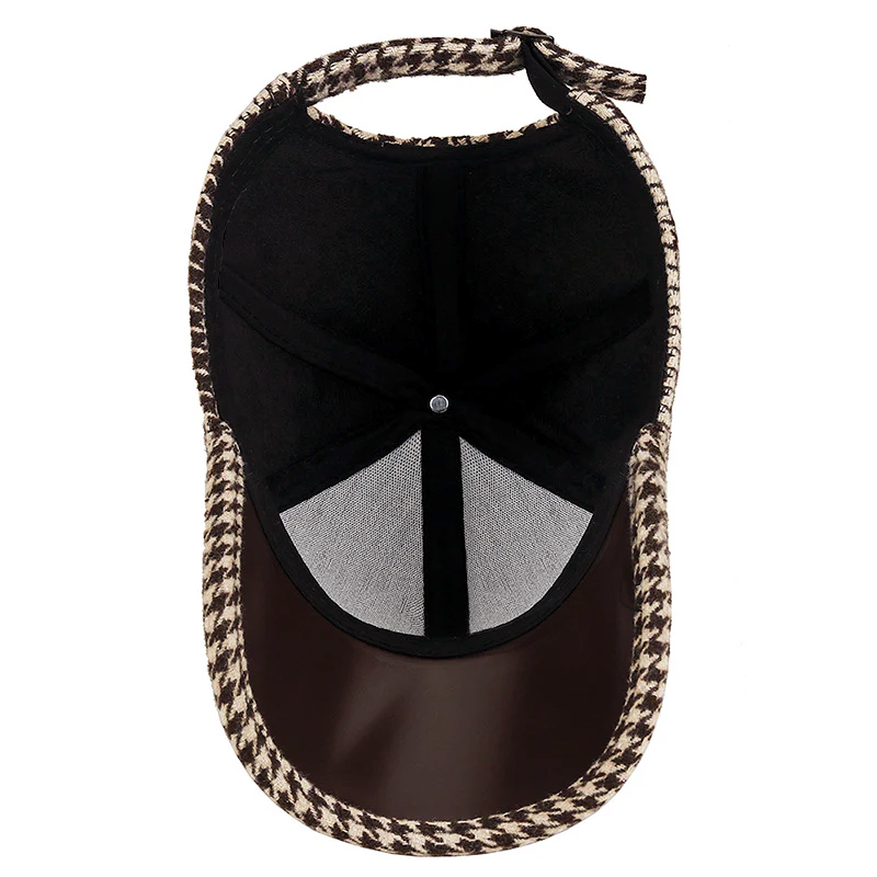 Justerbar herrkeps, grå houndstooth med mörka konstläderdetaljer, mångsidig accessoar.