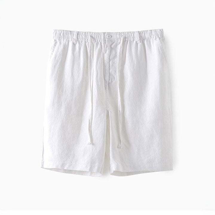 Närbild på textur av herrlinneshorts med elastisk midja, framhäver linnematerialet.
