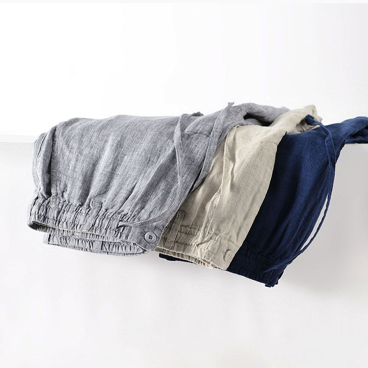 Vikta herrlinneshorts med elastisk midja, visar olika färger som finns tillgängliga.