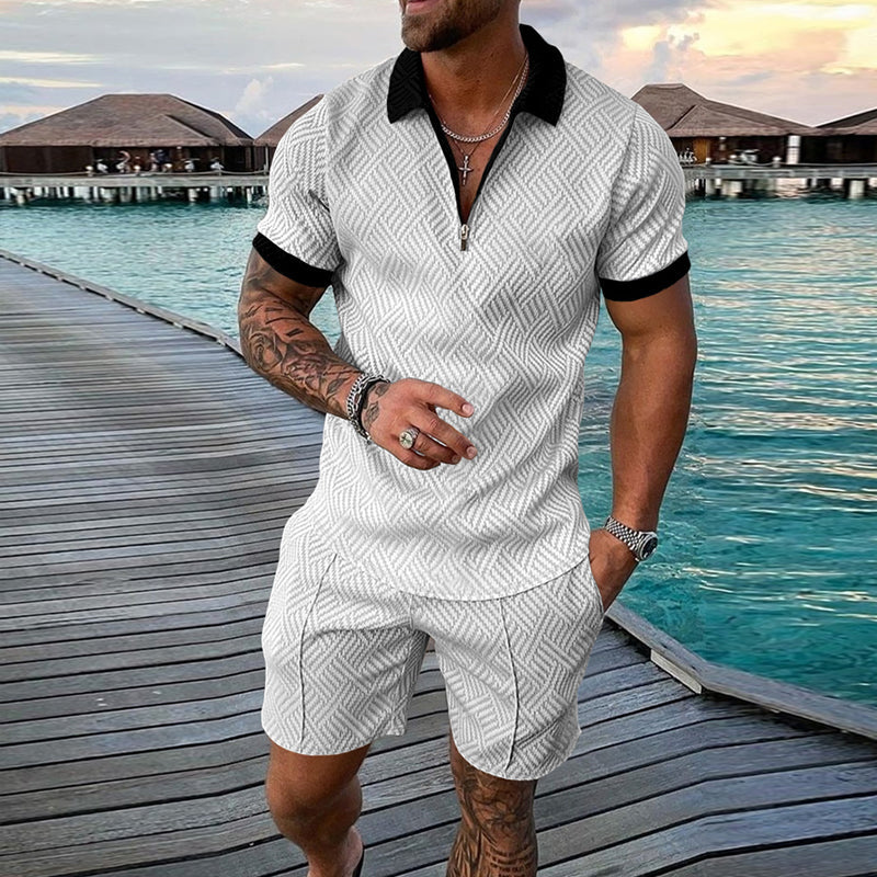 "Herrset med tryckt polo T-shirt och shorts, casual sommaroutfit, livliga mönster, perfekt för avslappnade stunder."