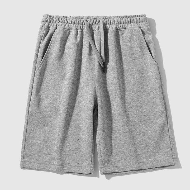 Herrshorts i avslappnad stil, knälånga, med praktiska fickor, bomullsblandning för skön komfort.