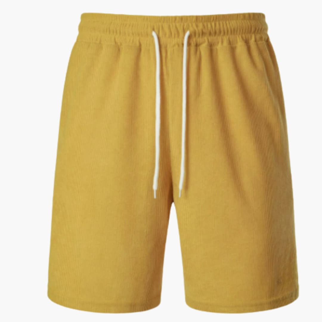 Stilrena herrshorts med dragsko och ribbad design. Bekväma sommarshorts för en avslappnad och trendig look.