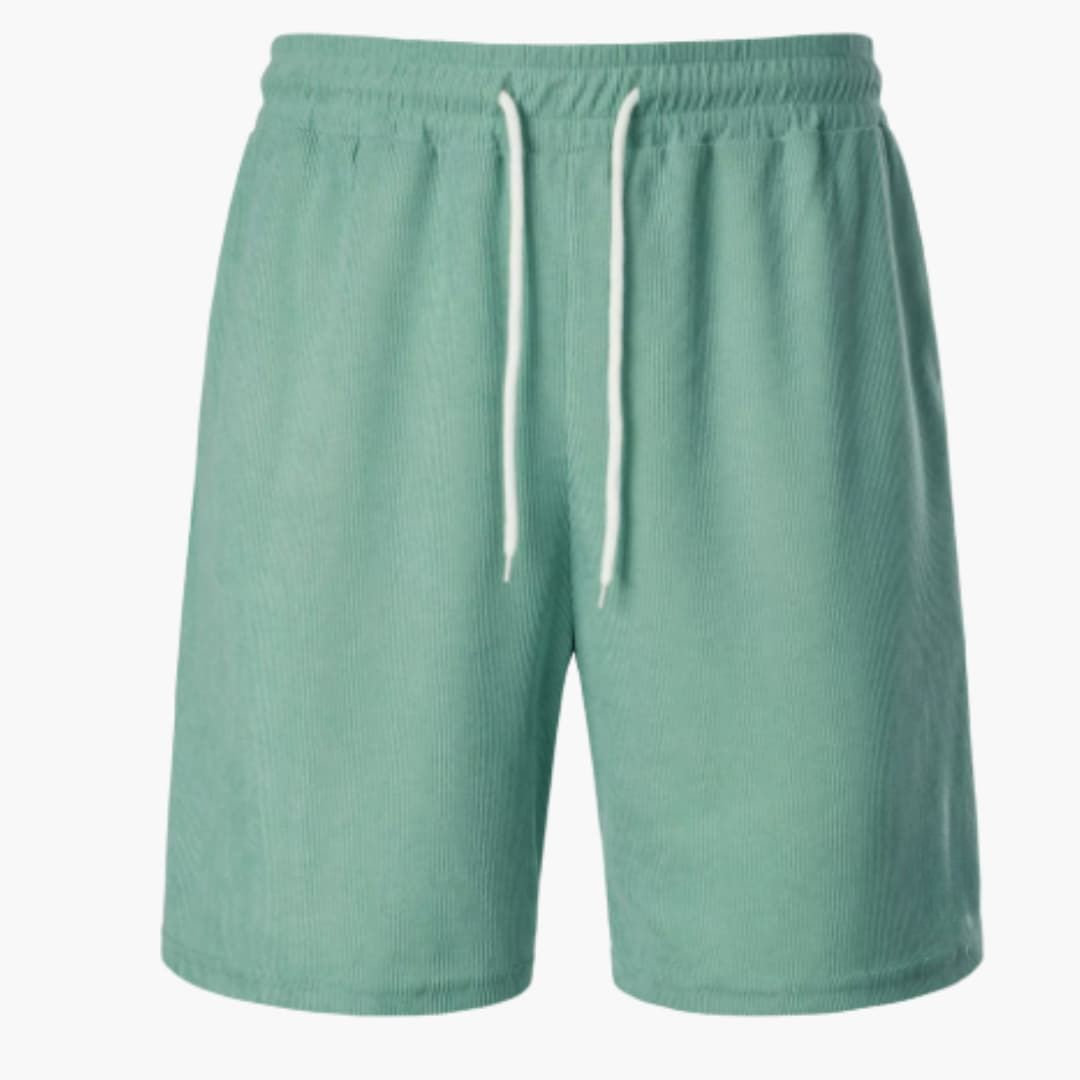 Baksida av stilrena herrshorts med ribbad textur. Bekväma sommarshorts med dragsko för vardagsbruk.