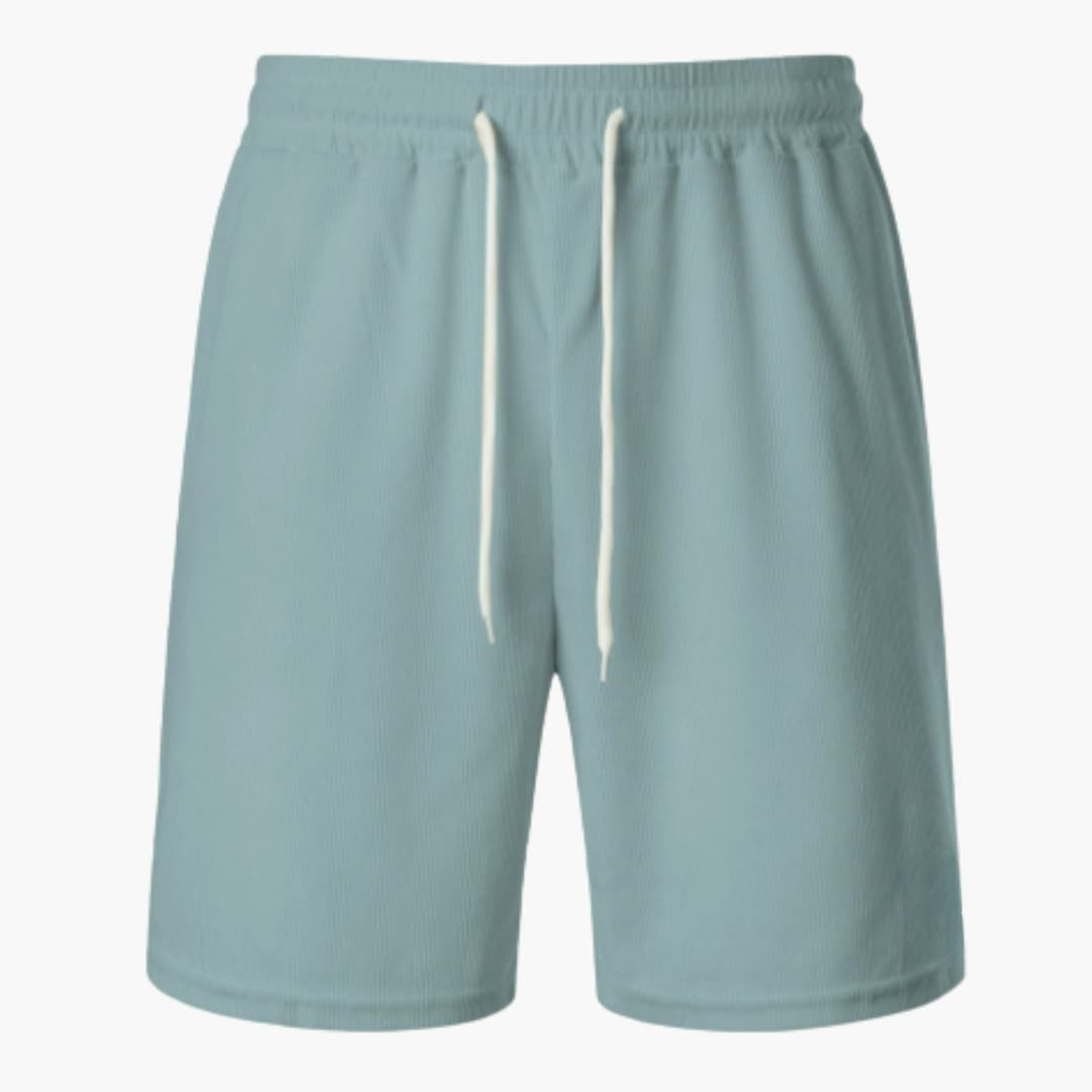 Herrshorts med dragsko och ribbad struktur på galge. Visa upp komfortabla och stilrena sommarshorts.