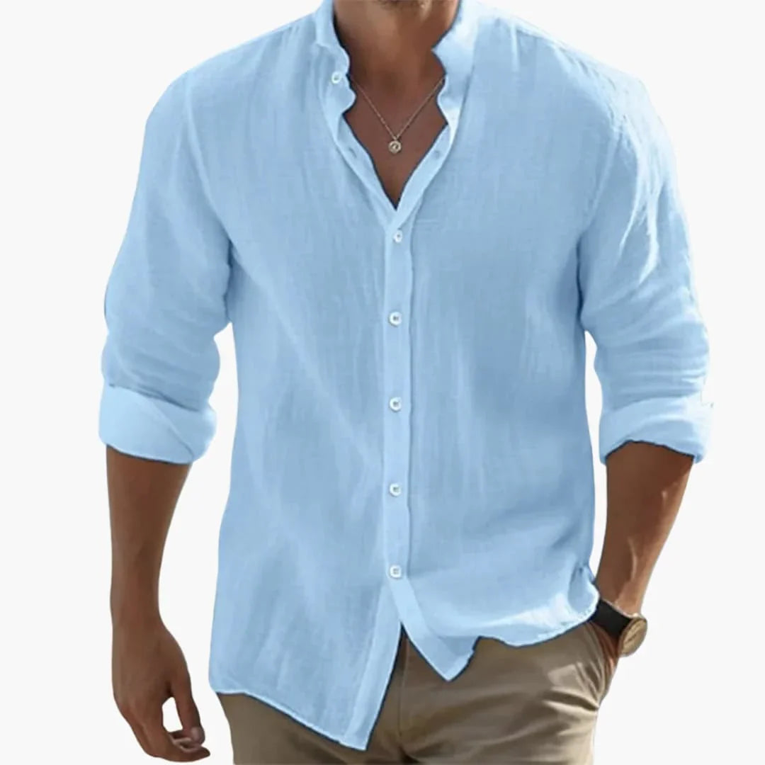 Långärmad herrskjorta med ståkrage och knappslå. Slim fit för en skarp, sofistikerad silhuett.
