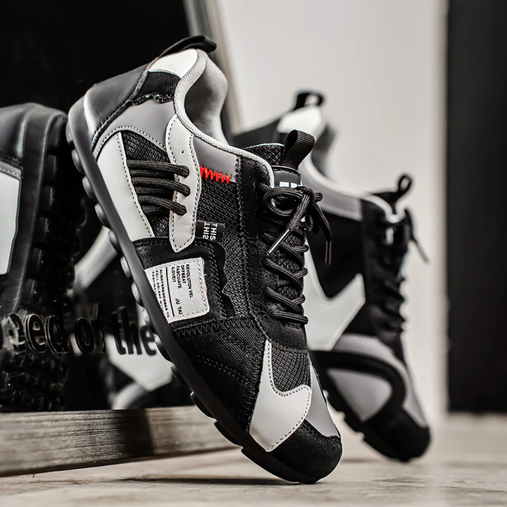 Unisex färgblockssneakers i PU-läder, bekväma och mångsidiga vardagsskor med snörning.