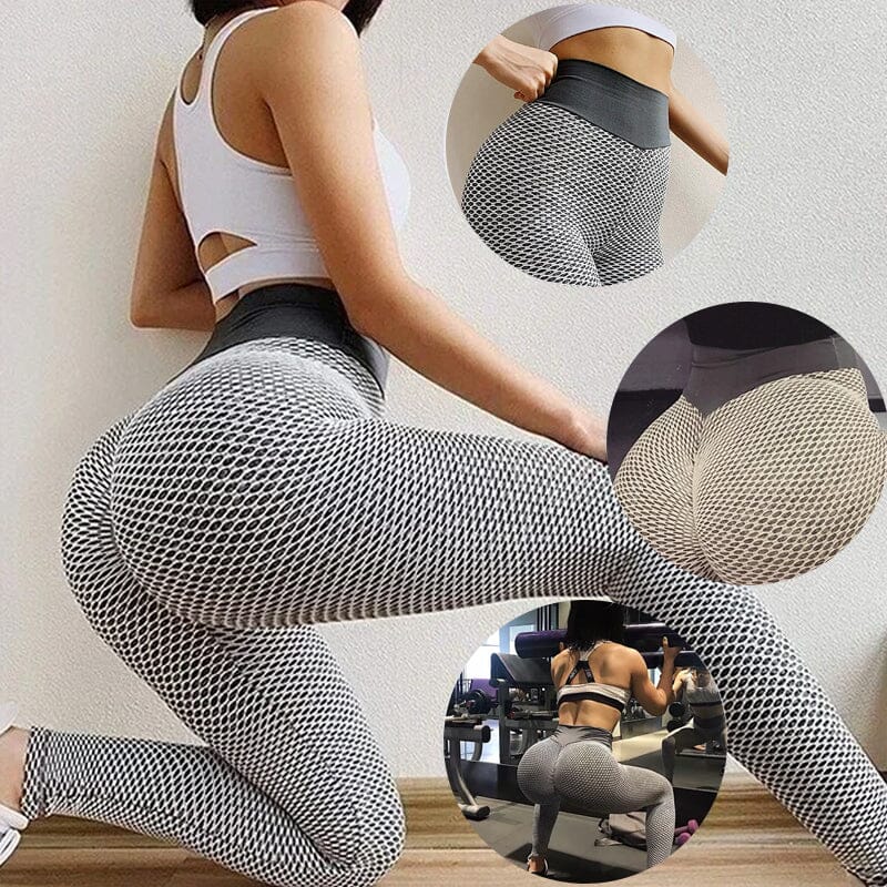 Högmidjade dam yoga leggings med rumplyft effekt och brett midjeband, i grå färg, för komfort och stil vid träning.
