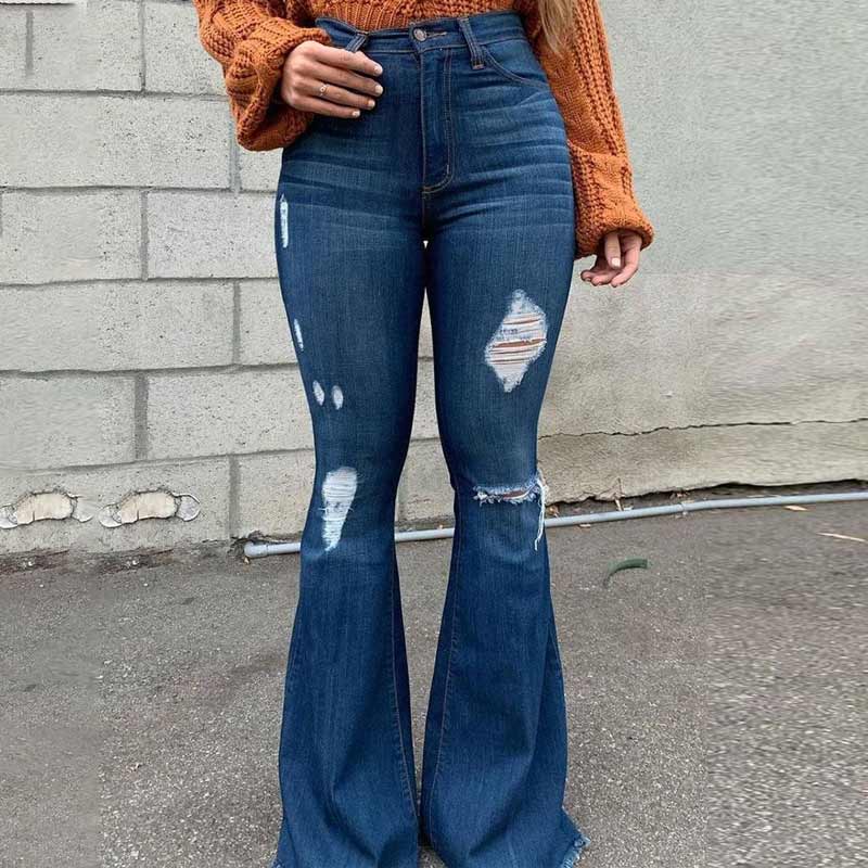 "Högmidjade damjeans med utsvängda ben och slitna detaljer, trendig siluett för moderiktig stil och komfort."