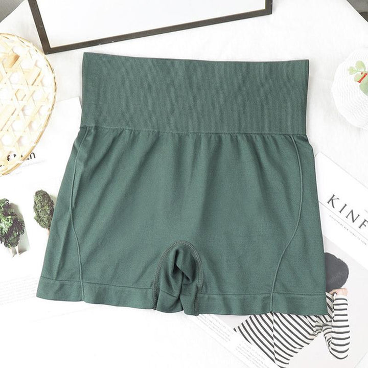 "Högmidjade sömlösa hotpants för kvinnor, bekväm passform i stilren grön färg, lyftande effekt och figurformning."