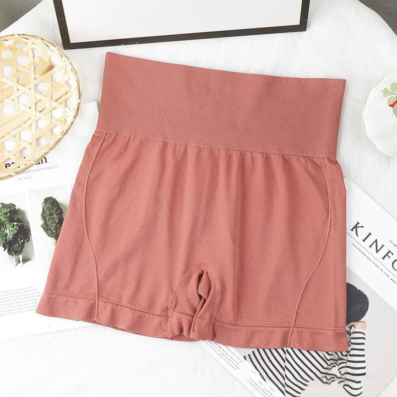 "Högmidjade sömlösa hotpants för kvinnor, bekväm passform i stilren grön färg, lyftande effekt och figurformning."