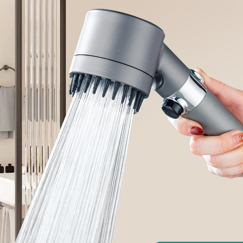 Högtrycksduschhuvud i grå ABS, tre lägen, modern design, kompakt och hållbart. Front view, liknar en hårtork.
