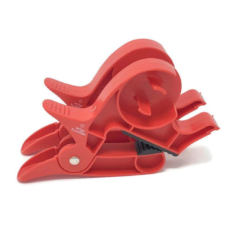 "Inslagningverktyg i röd och grå plast för presentinpackning, justerbar för olika pappersstorlekar."