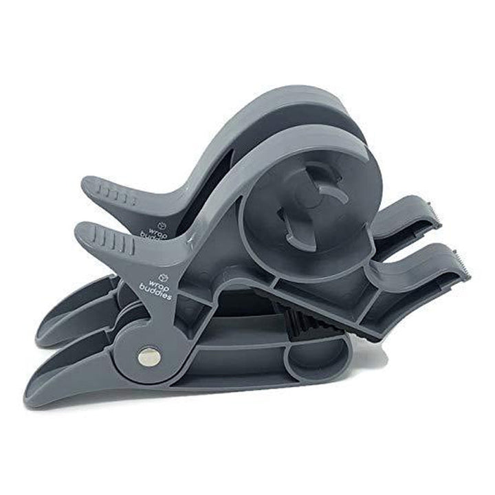 "Inslagningverktyg i röd och grå plast för presentinpackning, justerbar för olika pappersstorlekar."