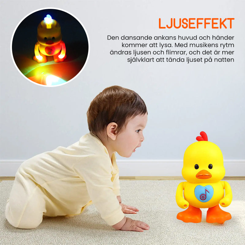 "Interaktiv dansande anka för barn med ljuseffekter, rörliga armar och ben, i ljus plast, perfekt leksak för rytmisk lek."
