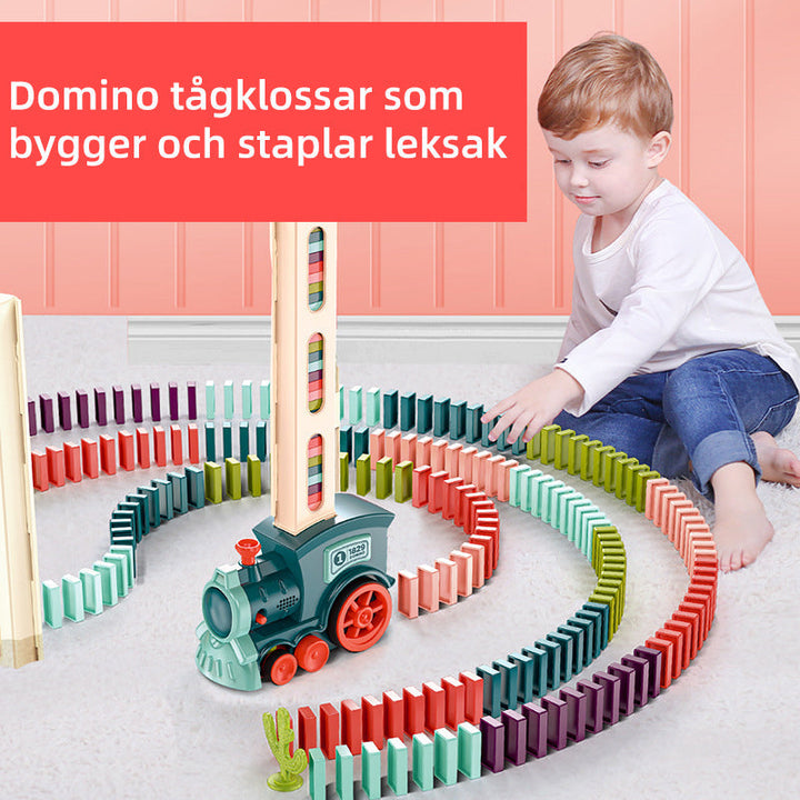 Interaktivt domino tåg med färgglada byggblock för barn, främjar kreativ lek och lärande genom ett automatiskt läggsystem.