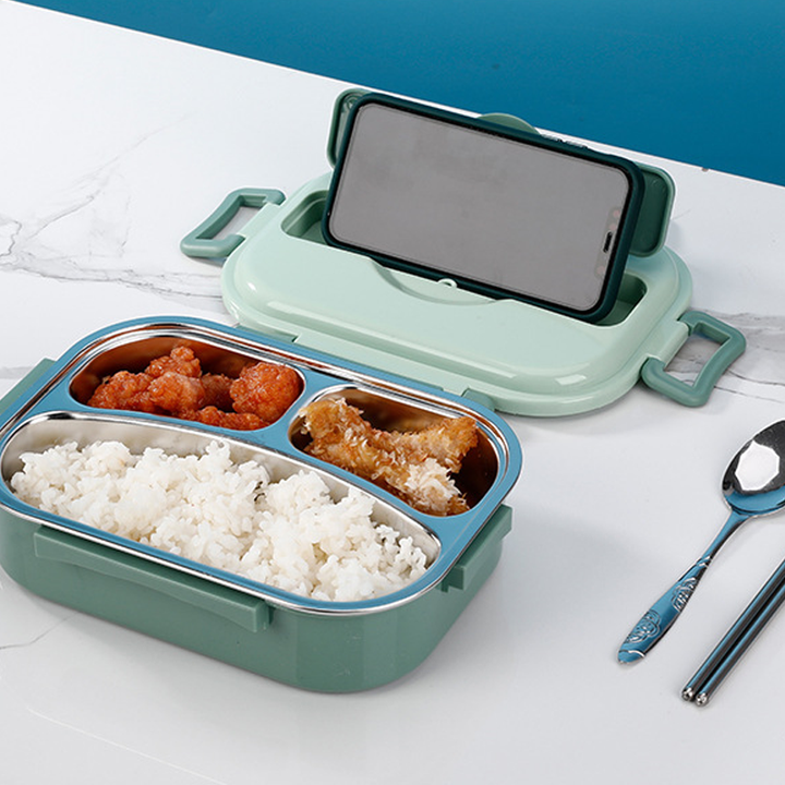 "Isolerad Bentobox i rostfritt stål med fyra fack för hållbar matförvaring. Smidig design i färgglada alternativ."