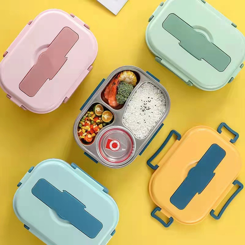 "Isolerad Bentobox i rostfritt stål med fyra fack för hållbar matförvaring. Smidig design i färgglada alternativ."