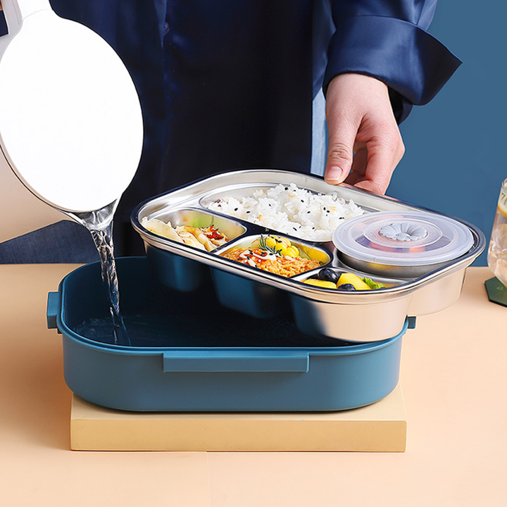 "Isolerad Bentobox i rostfritt stål med fyra fack för hållbar matförvaring. Smidig design i färgglada alternativ."