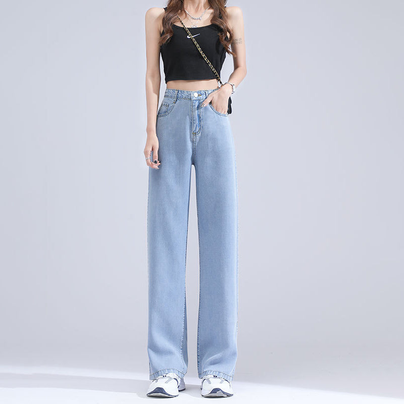 "Jeans med vida ben för kvinnor i blått lyocellmaterial med hög midja och raka ben, ger en smickrande och bekväm stil."