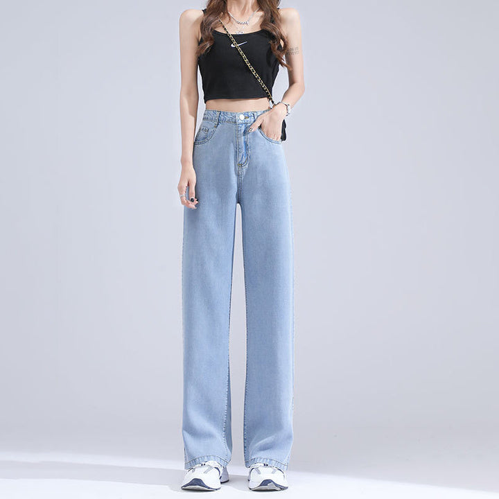 "Jeans med vida ben för kvinnor i blått lyocellmaterial med hög midja och raka ben, ger en smickrande och bekväm stil."