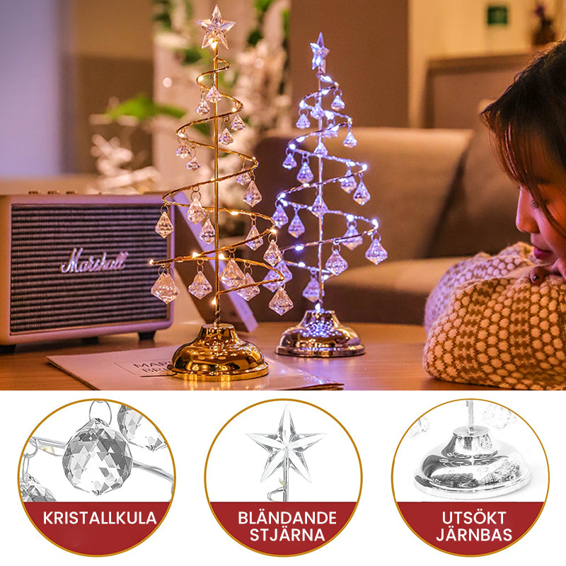 "Jul LED bordslampa i kristallform som lyser i varmt guld eller silvervitt, elegant dekoration för festlig atmosfär."