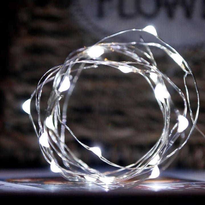 "Jul ljusslinga med koppartråd, USB-kontroll och stjärndice effekter, perfekt för vinterdekoration och feststämning."