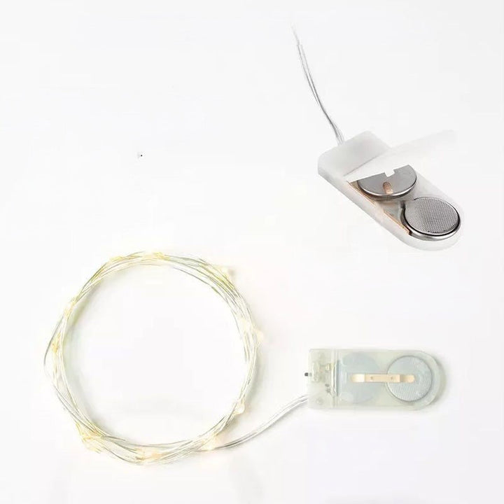 "Jul ljusslinga med koppartråd, USB-kontroll och stjärndice effekter, perfekt för vinterdekoration och feststämning."