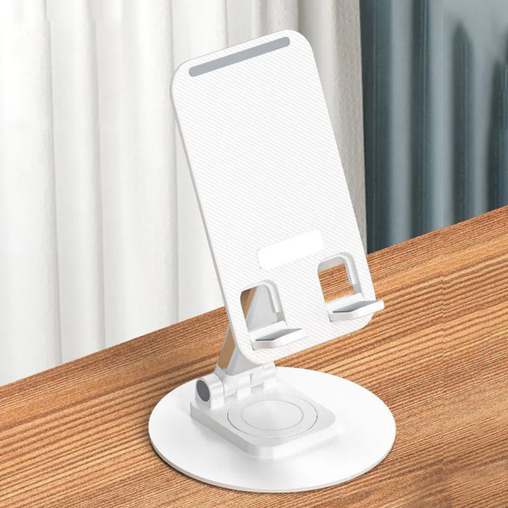 Justerbar 360° rotationshållare i metall med halksäkra kuddar för telefon/surfplatta, elegant och kompakt design.