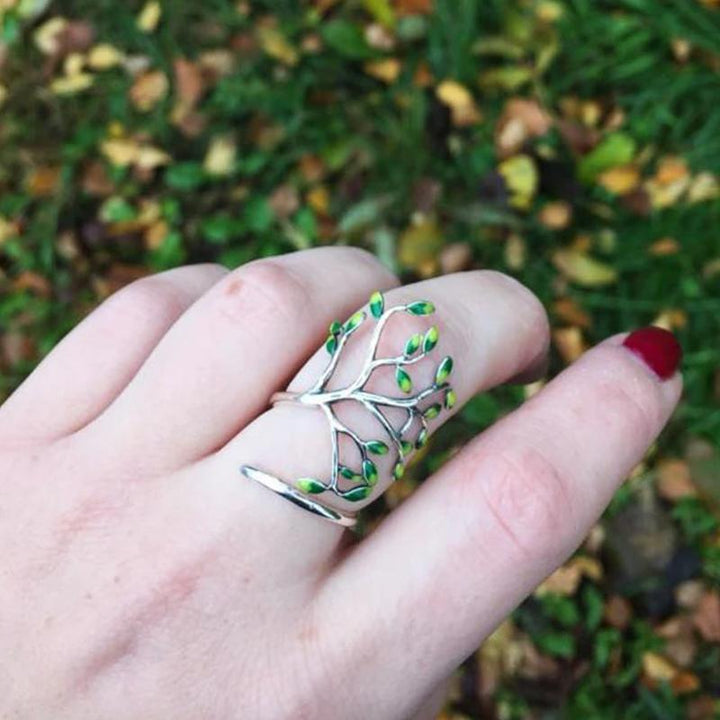 Justerbar olivträd ring i silver med gröna blad, damaccessoar som symboliserar fred och skönhet.