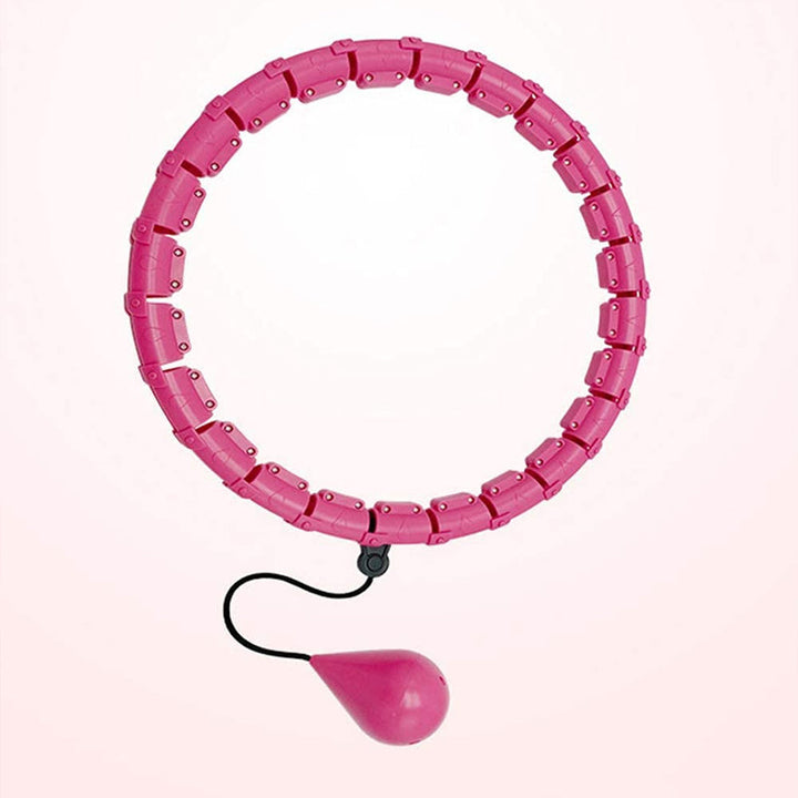 "Justerbar rosa och lila hula hoop i plast, 24 sektioner, för effektiv hemmaträning mot kaloriförbränning."