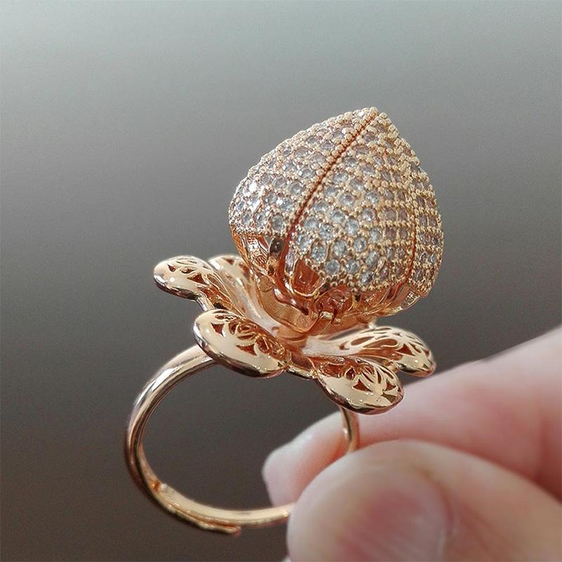 "Justerbar roterande rosring med zirkon, kopparmaterial, eleganta kronblad, strålande glans, tidlös skönhet."