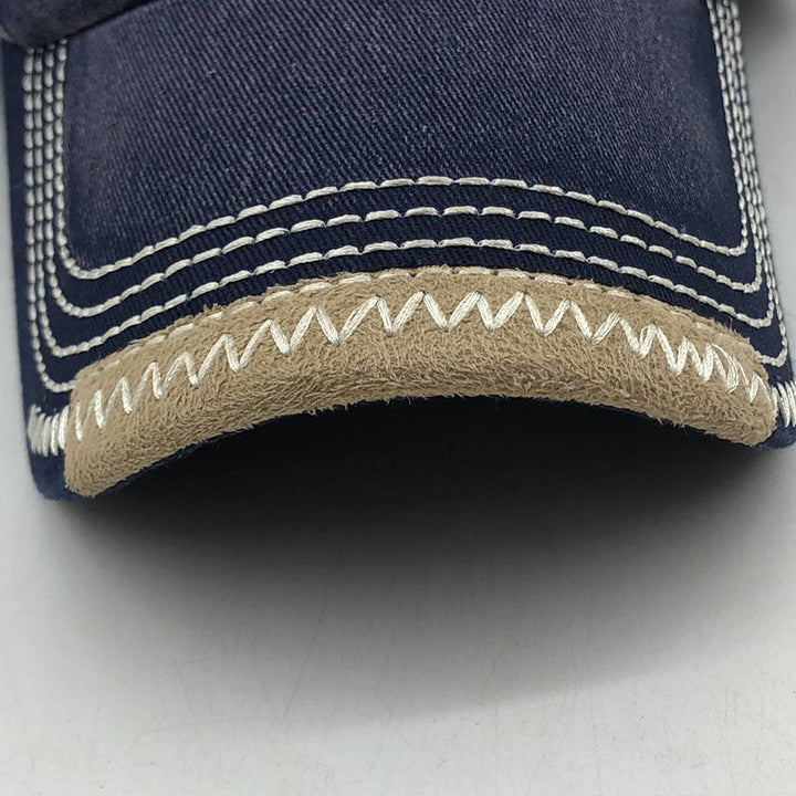 "Justerbar unisex baseballkeps i bomull med broderade detaljer, i flera färger, kupolformad med kort brätte."