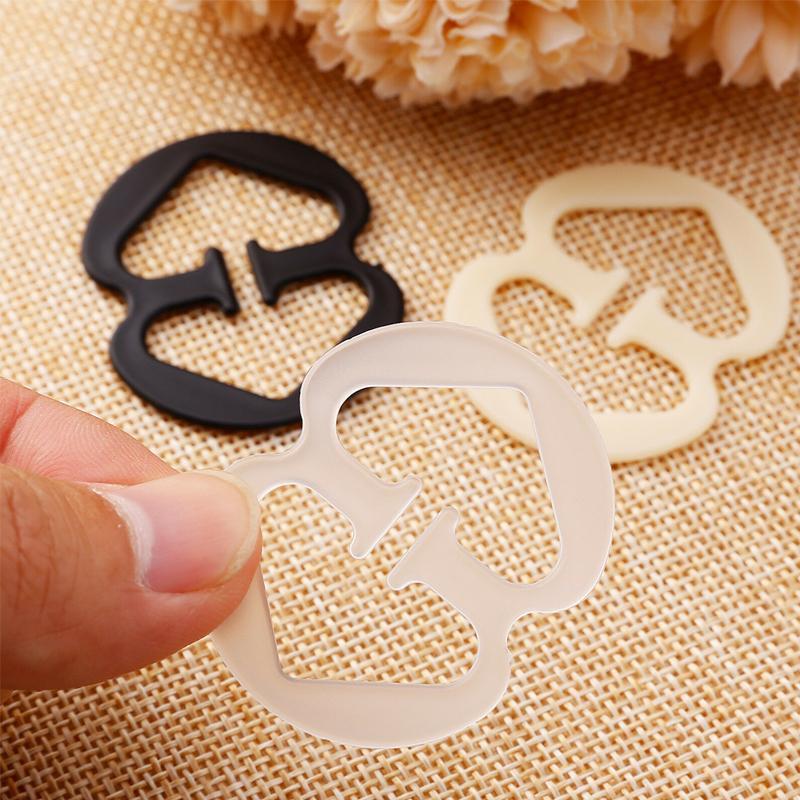 "Justerbar unisex bh-bands döljar i plast, rund och 8-formad; finns i svart, vit, beige, för racerback klänningar."
