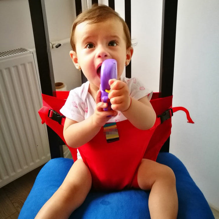 Justerbart babysäkerhetsbälte för stolar, grönt och portabelt, förvandlar stolar till säkra platser för barn.