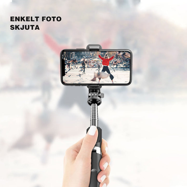 Justerbart Bluetooth selfie-stick och stativ, silver, kompakt design, inbyggd fjärrkontroll, för fotografering och resor.