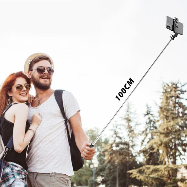 Justerbart Bluetooth selfie-stick och stativ, silver, kompakt design, inbyggd fjärrkontroll, för fotografering och resor.