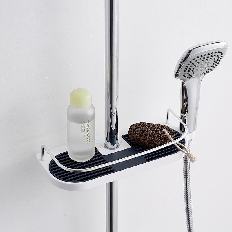 Justerbart duschförvaringsställ med avtagbar bottenplatta, vit plast, ihålig design för optimal vattendränering.