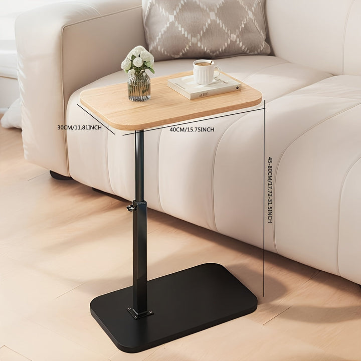 Ergonomiskt justerbart sidobord, idealiskt för laptopanvändning i vardagsrum.