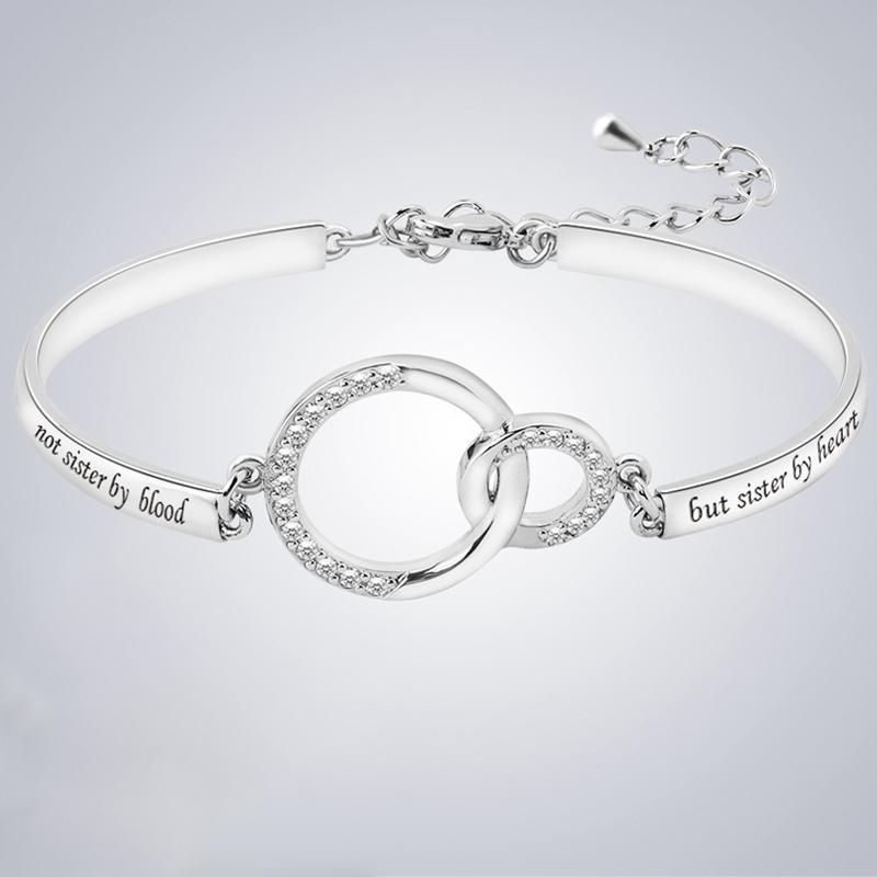 "Justerbart silver och rosguld vänskapsarmband för kvinnor med strass och graverad symbolik, elegant design."