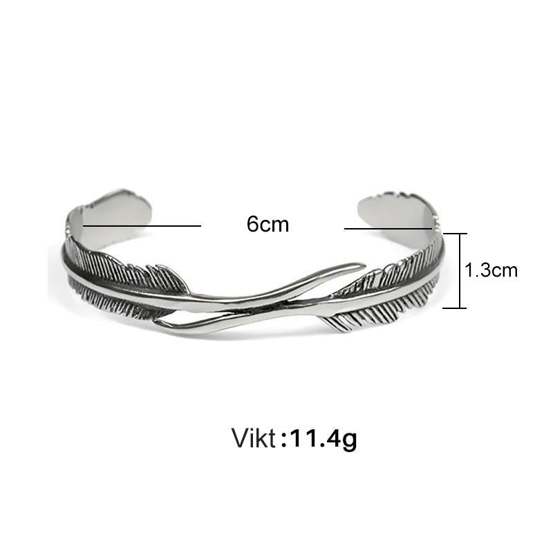 "Justerbart silverfjäderarmband för kvinnor, nickelfritt och elegant design med symboliskt fjädermotiv."