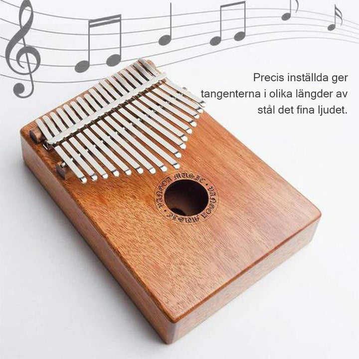 "Kalimba Tumb Piano i mahognyträ med 17 tangenter, bärbart musikinstrument, handhållet, elegant design och varmt ljud."