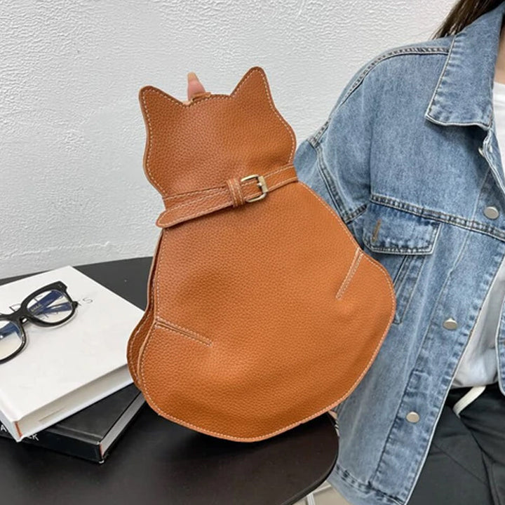 "Kattformad korsväska i svart PU-läder för kvinnor, unikt kattdesign, stilren och rymlig accessoar."