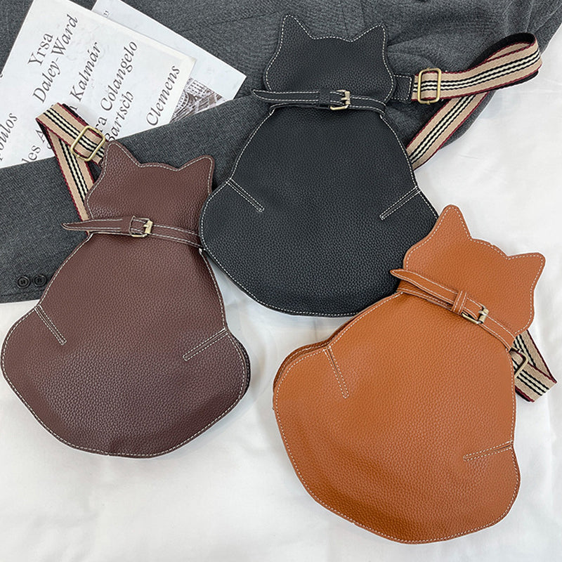 "Kattformad korsväska i svart PU-läder för kvinnor, unikt kattdesign, stilren och rymlig accessoar."