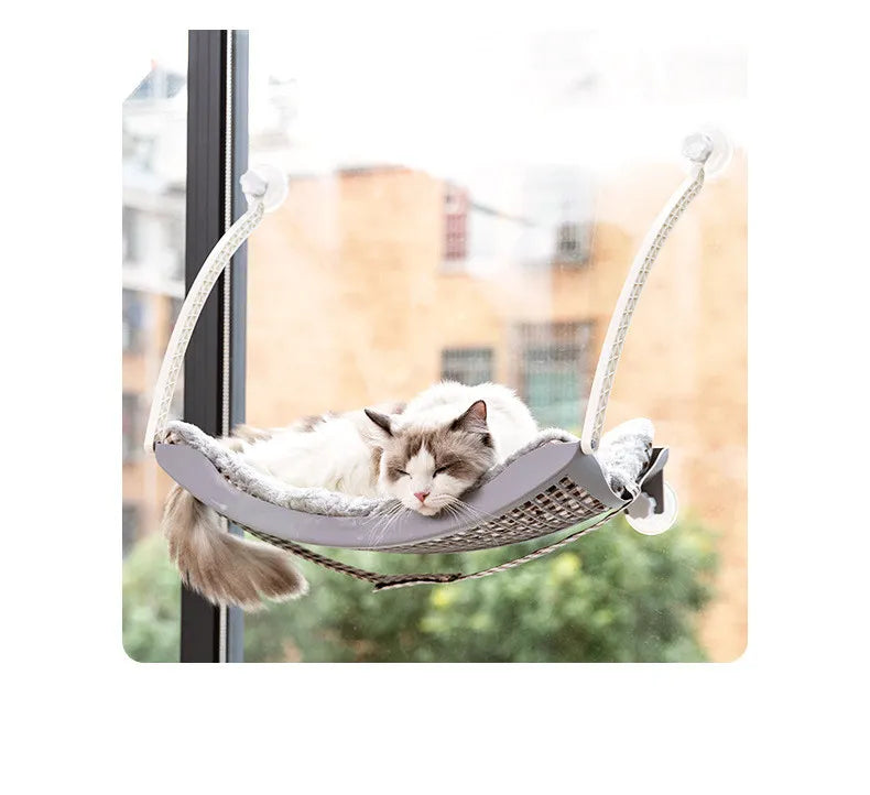 Mysig kattbädd fönsterhängmatta, optimal solplats. Ger katten en varm och bekväm viloplats med utsikt.